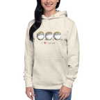 Woman wearing cream hoodie with 'I ❤️ triple pots' graphic, featuring three pots of gold coins, slot-themed apparel