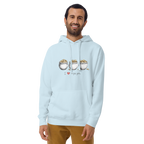 Man wearing light blue hoodie with 'I ❤️ triple pots' graphic, featuring three pots of gold coins, perfect for slot machine fans.