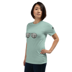 Woman wearing mint green t-shirt with slot machine sunglasses graphic, perfect for casino lovers and gaming fans.