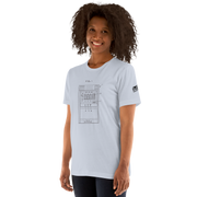 Woman wearing light blue t-shirt with slot machine patent diagram graphic, quirky casino-themed apparel