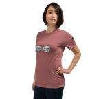 Woman wearing pink t-shirt with slot machine sunglasses graphic, featuring 7s and BAR symbols for casino-themed apparel