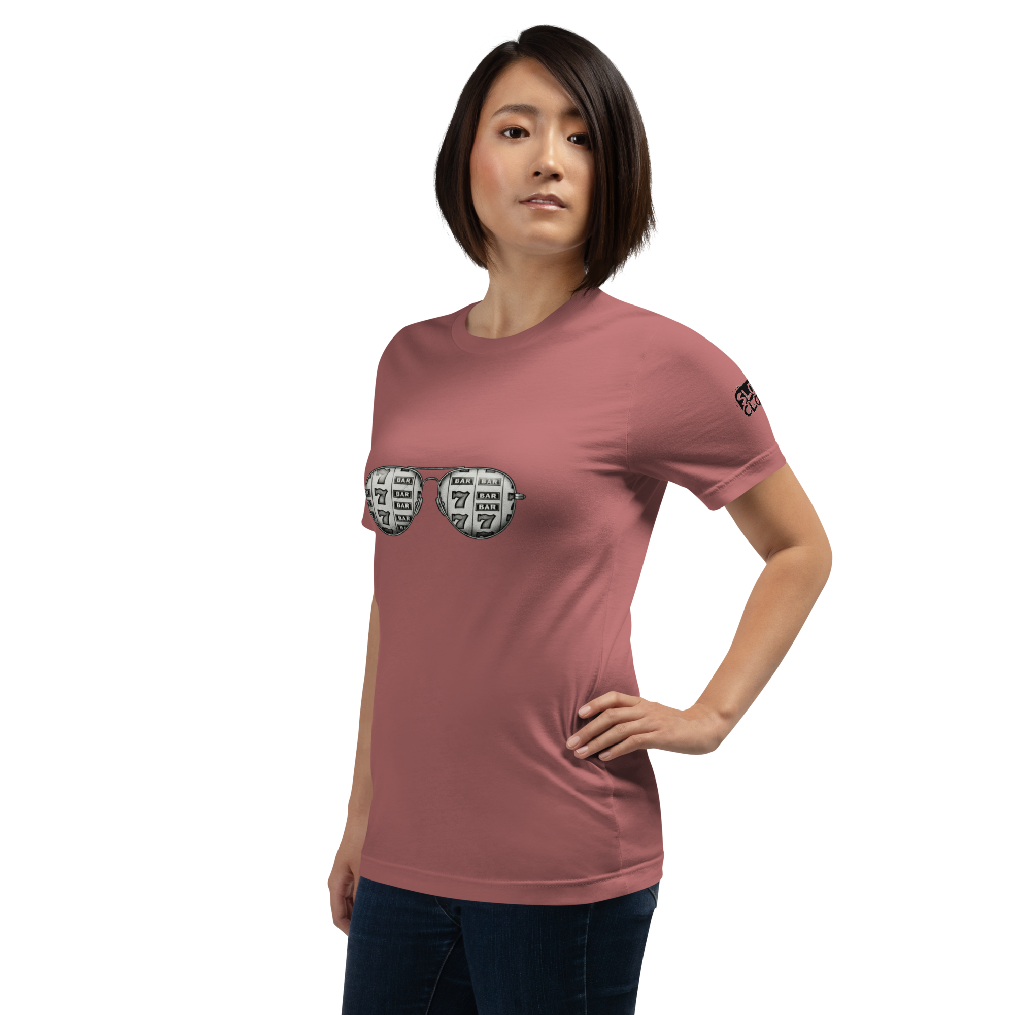 Woman wearing pink t-shirt with slot machine sunglasses graphic, featuring 7s and BAR symbols for casino-themed apparel
