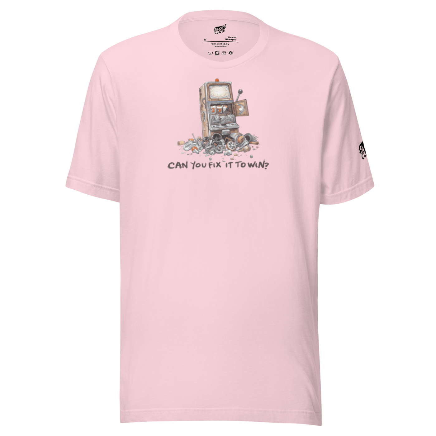 Pink t-shirt with broken slot machine graphic and text 'CAN YOU FIX IT TO WIN?'